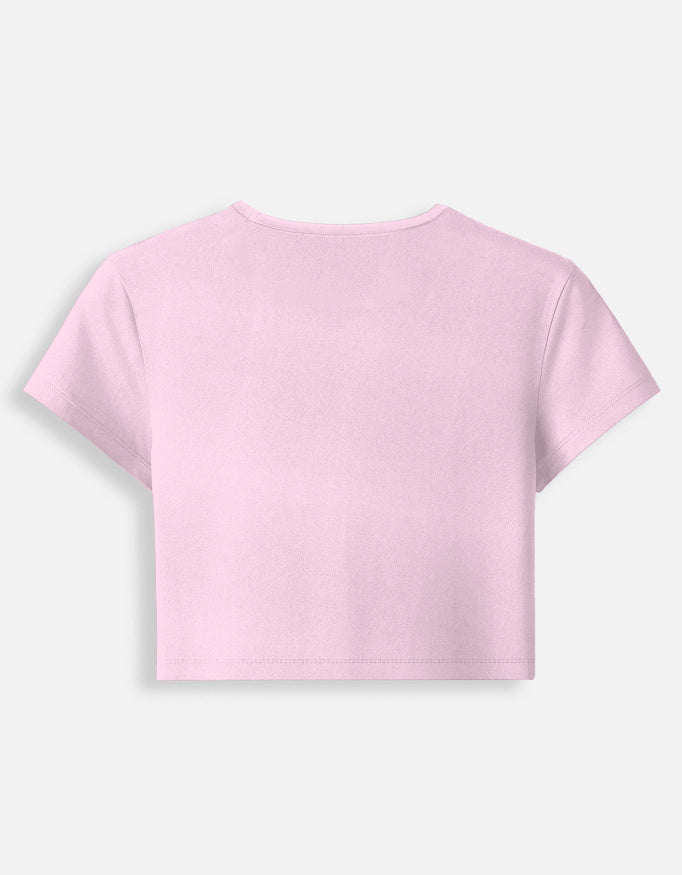 Growing Gently self-growth quote printed on soft cropped baby tee