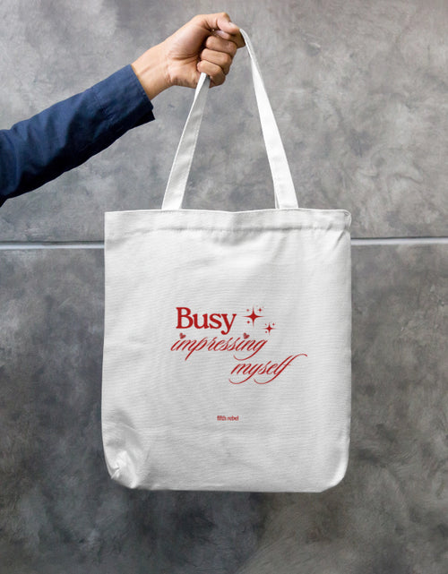 Busy Impressing Myself confidence quote printed on cotton canvas tote bag