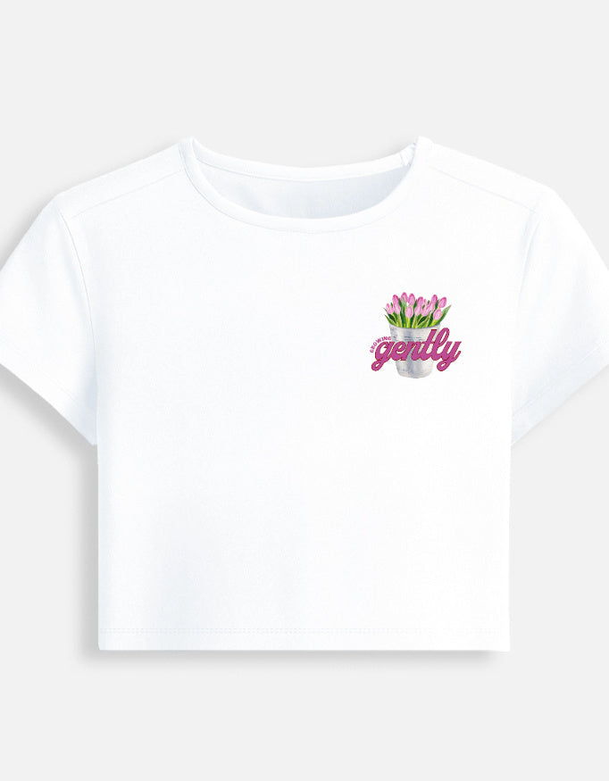 Growing Gently self-growth quote printed on soft cropped baby tee