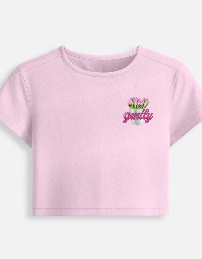 Growing Gently self-growth quote printed on soft cropped baby tee