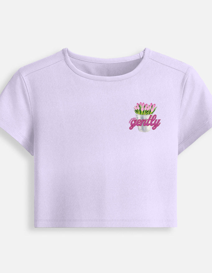 Growing Gently self-growth quote printed on soft cropped baby tee